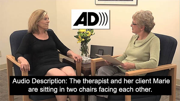 Photo of a woman talking with another person. A caption reads "Audio Description: The therapist and her client Marie are sitting in two chairs facing each other."