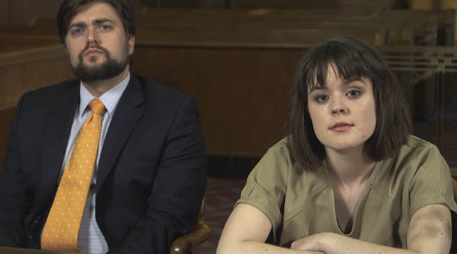 A juvenile victim of sex trafficking sitting at a table with her attorney