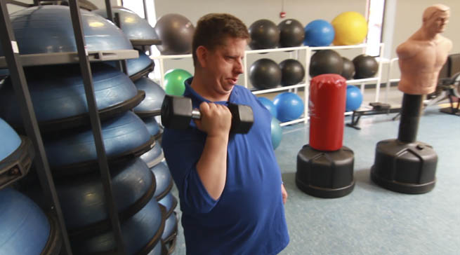 Photo of a young man with disabilities wokring out at the YMCA