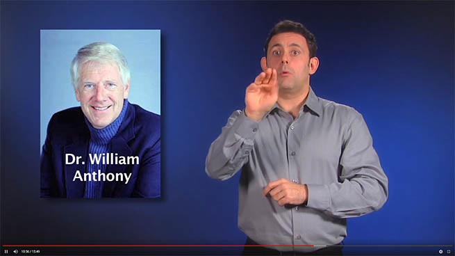 Photo of a man signing in ASL next to a picture of Dr. William Anthony